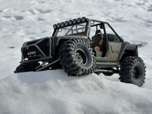 VS4 10 Chassis INJORA Customized Jeep. Fully modified 1/10 scale body with weatherized interiors, knights customs 3D printed parts and make shift front and body tubular steel rollbars.